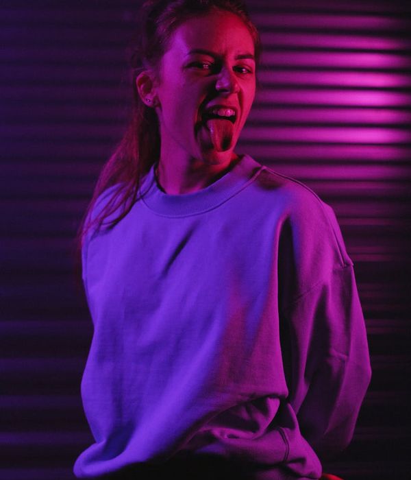 Woman feeling energetic and vibrant in a modern living room.